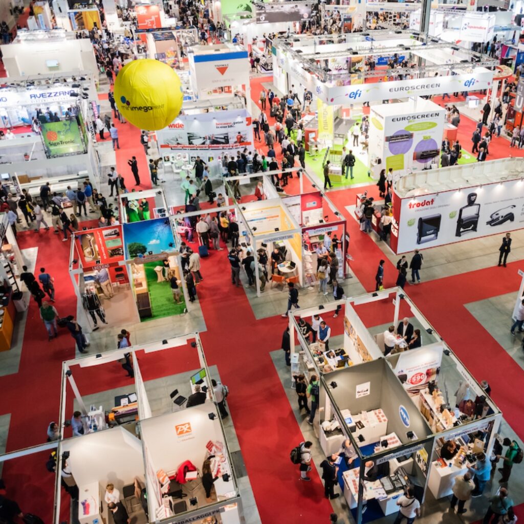 A bird's eye view of a trade show floor with several different booths.