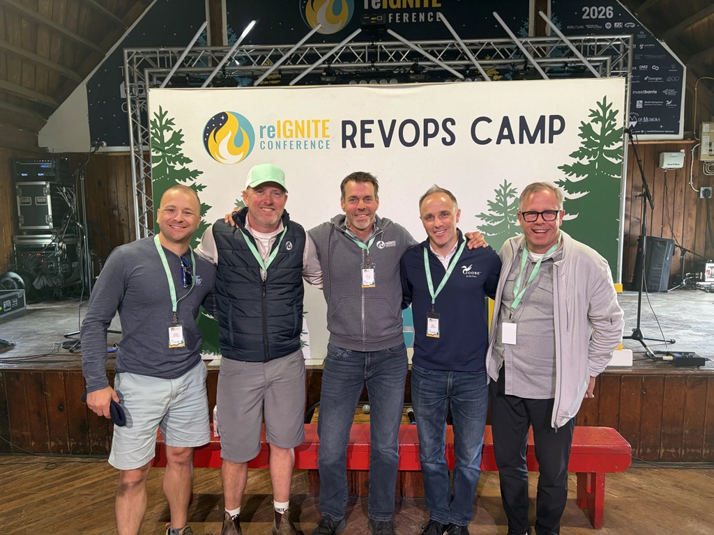 Kevin Butler and Michael Turcsanyi of Goose Digital alongside other attendees at the RevOPS Camp stage at reIGNITE 2026.