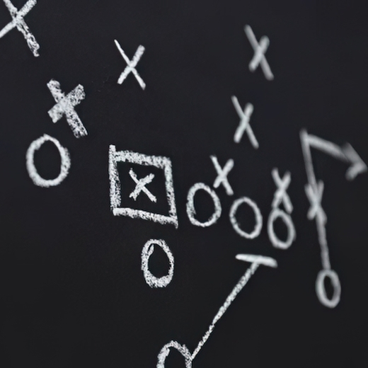 A play written on a chalkboard with white chalk.